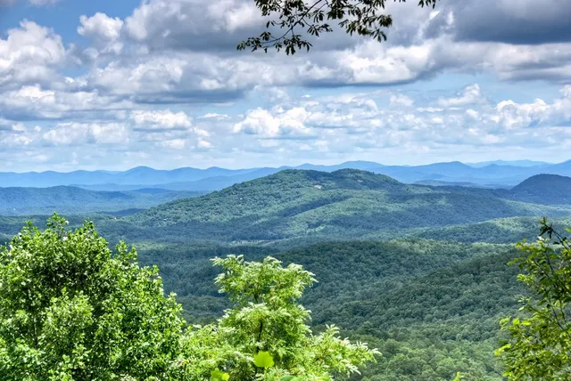 a kitchen with stainless steel appliances granite countertop a stove refrigerator and cabinets