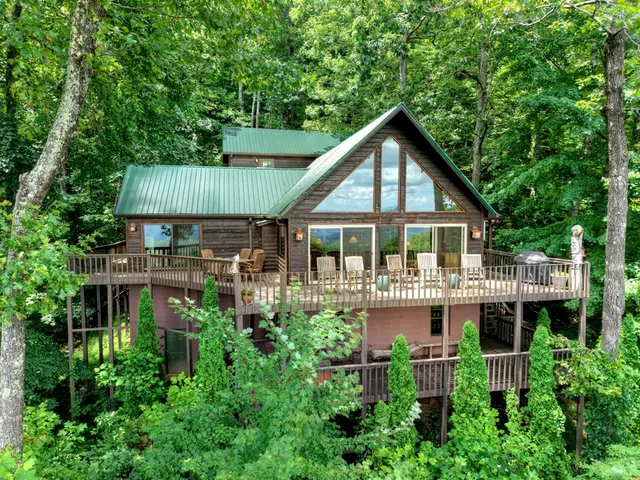 a bathroom with a granite countertop toilet sink and mirror