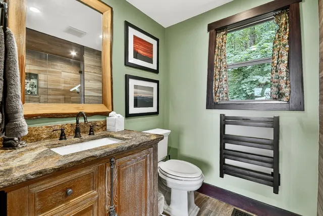 a bedroom that has a bed and a table in it