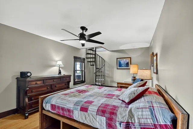 a view of a house with backyard sitting area and garden