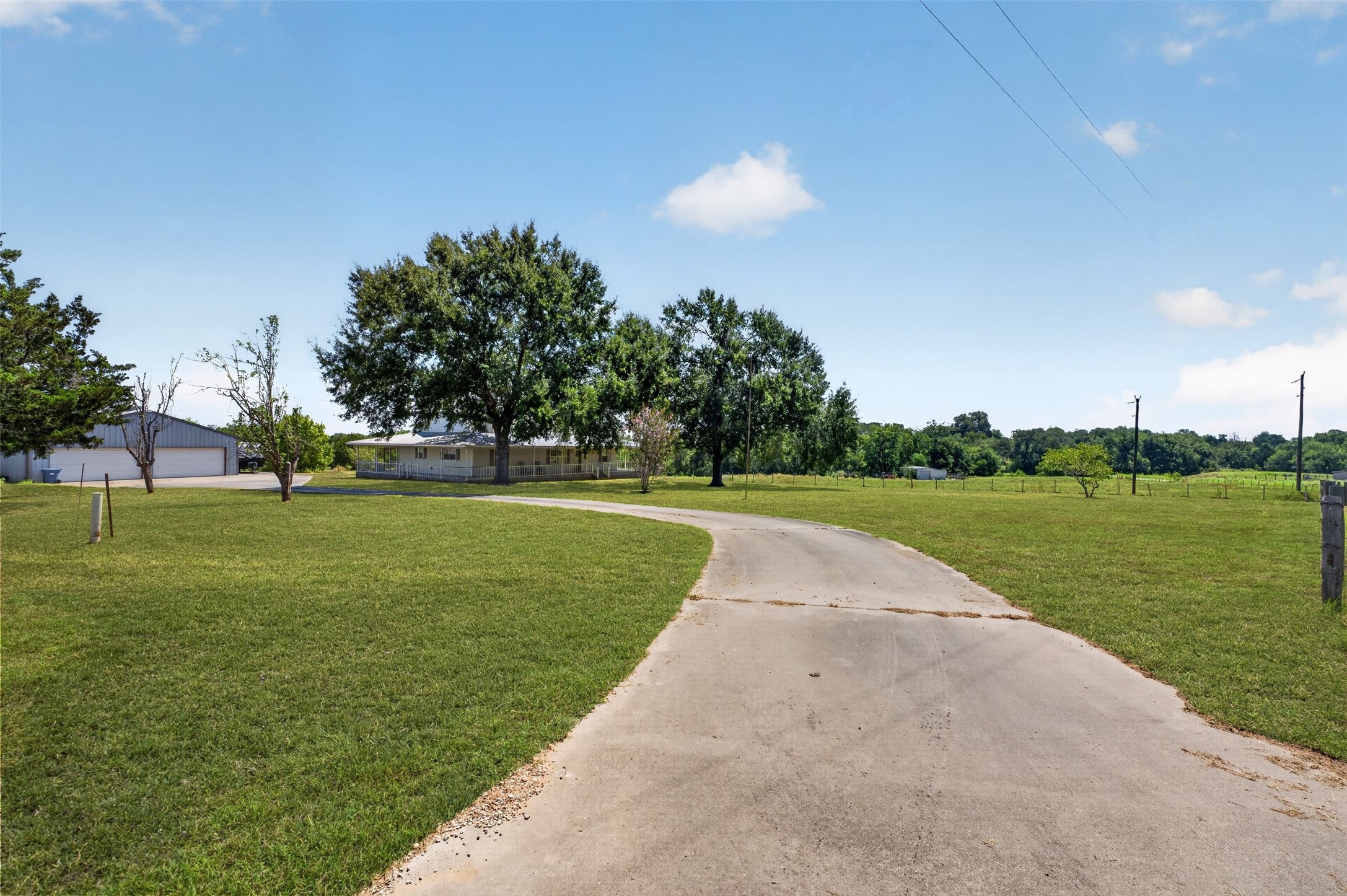 3085 Shupak Road Bellville, TX 77418 - Photo 6 of 42 A view from the entrance. There's no dust on your car from this driveway!