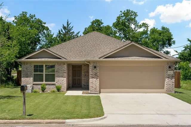 a house with garden in front of it