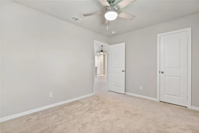 an empty room with a bathroom