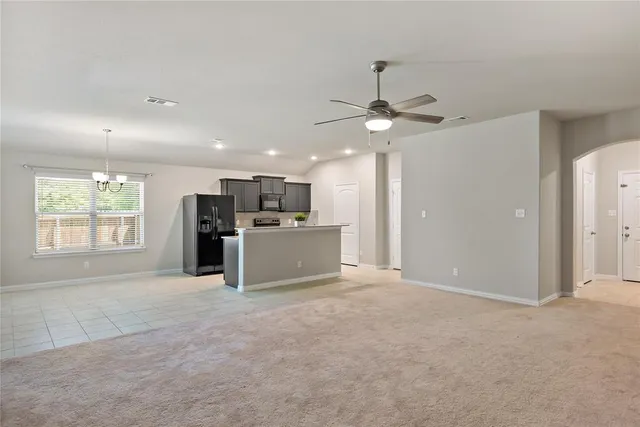 a view of a kitchen with a sink and a window