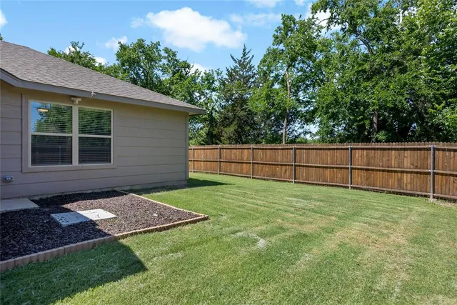 a view of a backyard with a garden