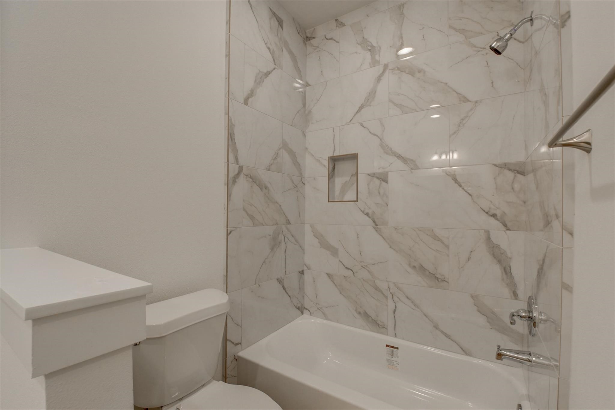 8410 Sandra Street Houston, TX 77016 - Photo 14 of 23 a bathroom with a bathtub and toilet