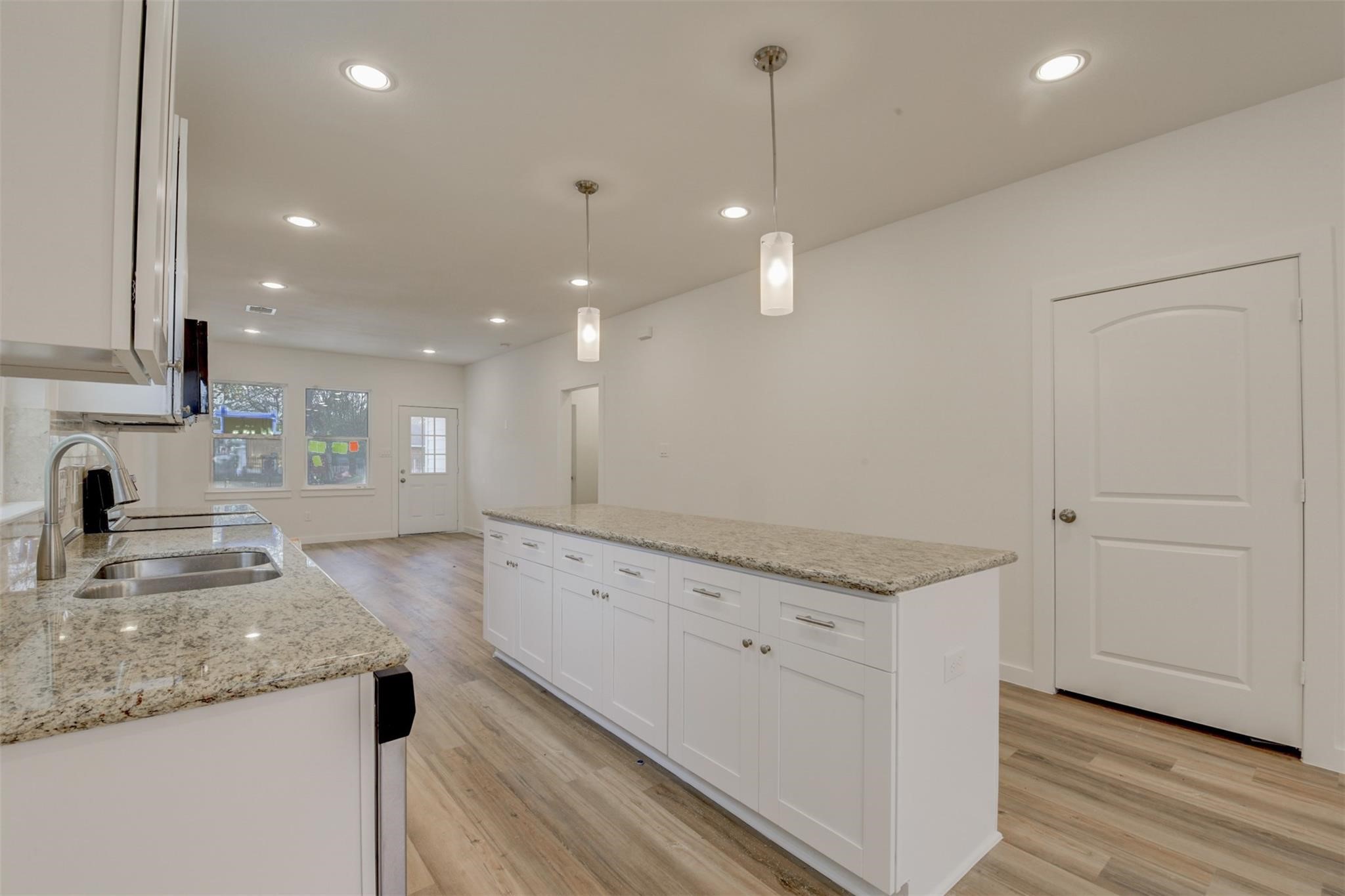 8410 Sandra Street Houston, TX 77016 - Photo 6 of 23 a view of a kitchen with kitchen island a sink stainless steel appliances and cabinets