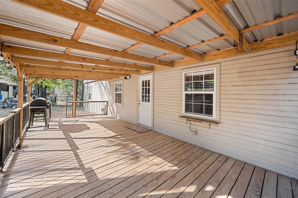 134 Maple Avenue Streetman, TX 75859 - Photo 16 of 19 a view of a balcony with wooden floor