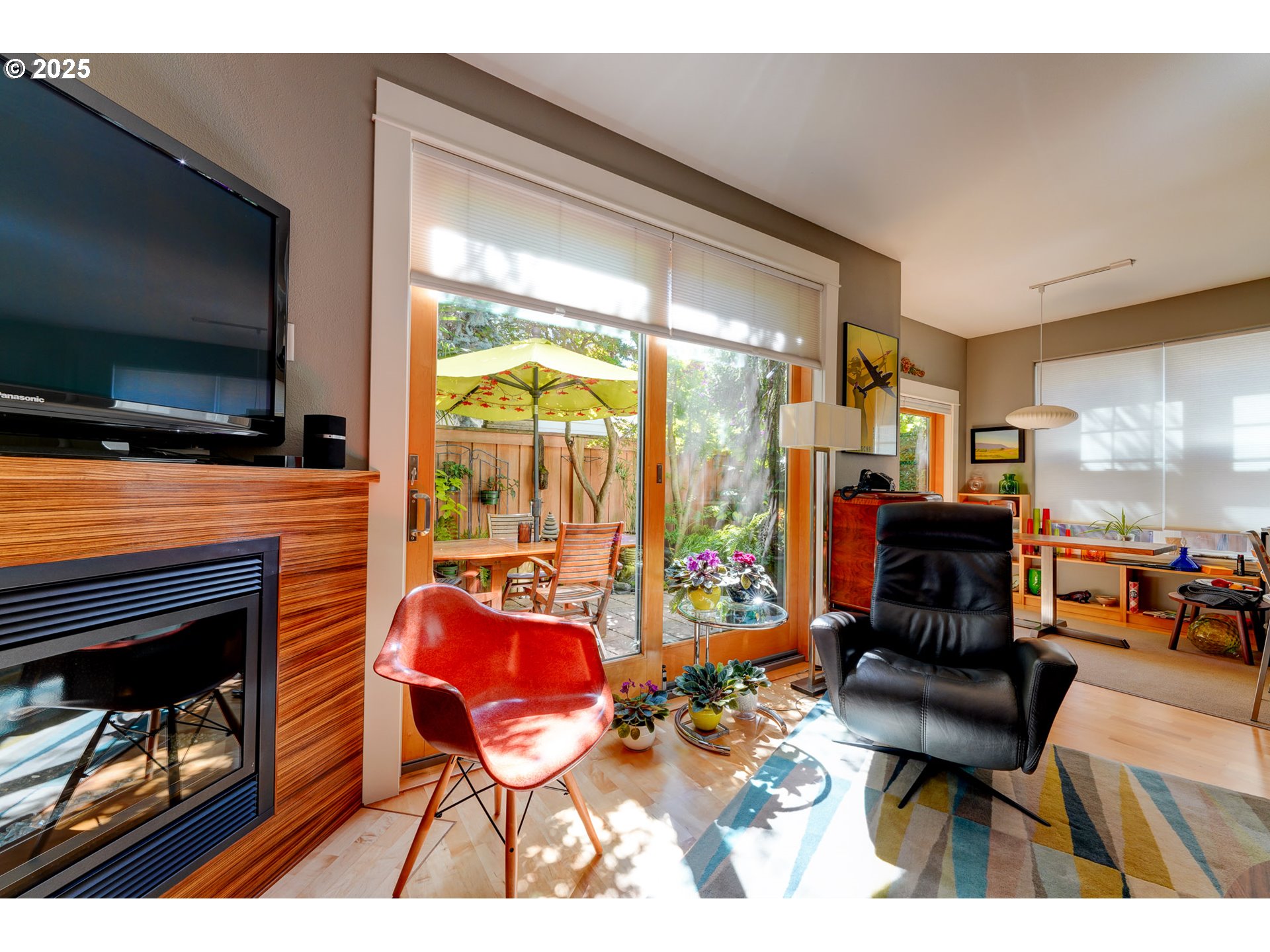 502 Northeast Knott Street Portland, OR 97212 - Photo 11 of 44 a living room with patio furniture and a flat screen tv