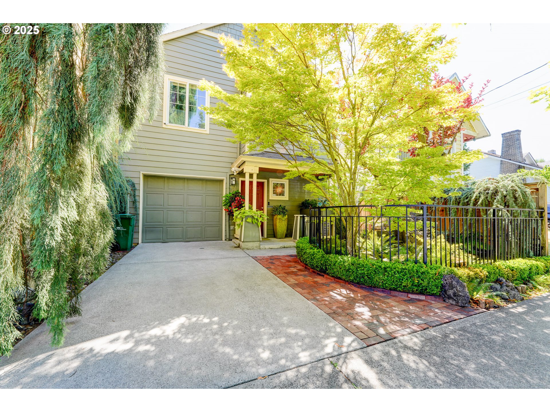 502 Northeast Knott Street Portland, OR 97212 - Photo 2 of 44 a front view of a house with a yard and garage