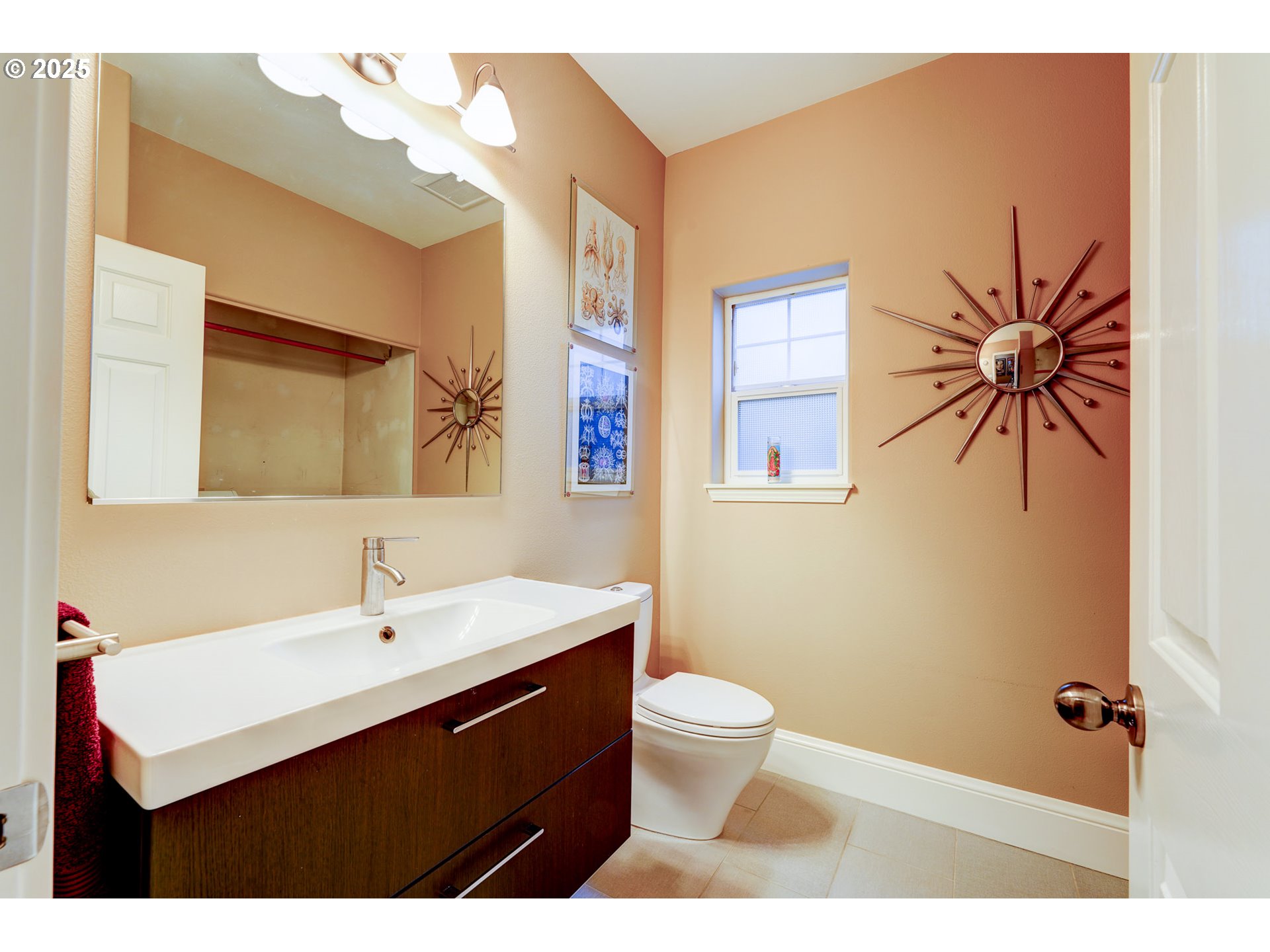 502 Northeast Knott Street Portland, OR 97212 - Photo 23 of 44 a bathroom with a sink a toilet and mirror