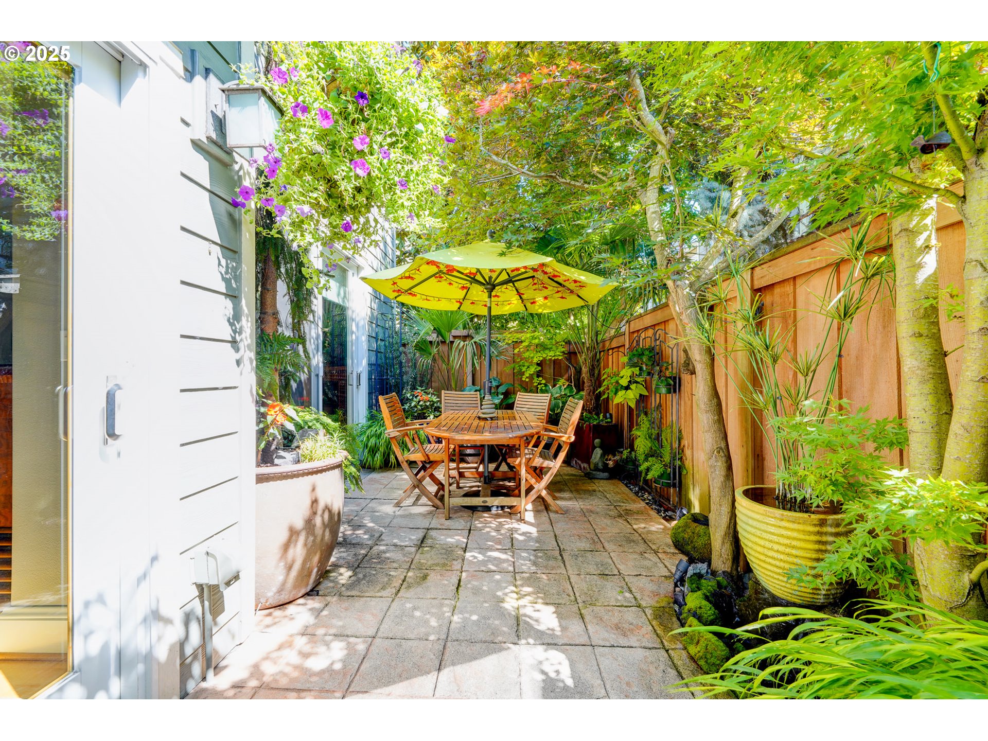 502 Northeast Knott Street Portland, OR 97212 - Photo 40 of 44 a view of a patio with table and chairs under an umbrella