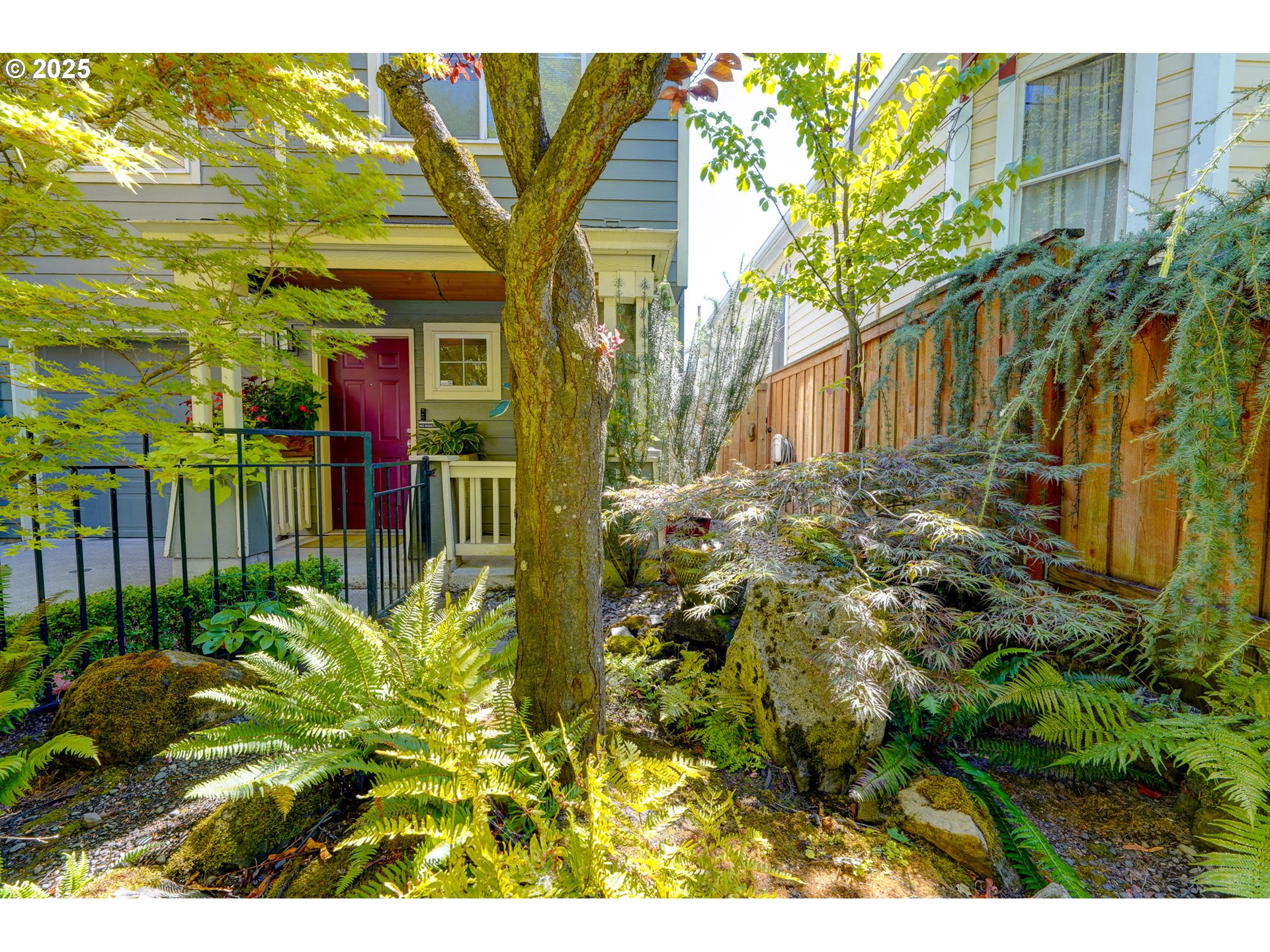 502 Northeast Knott Street Portland, OR 97212 - Photo 4 of 44 a view of a house with a flower garden