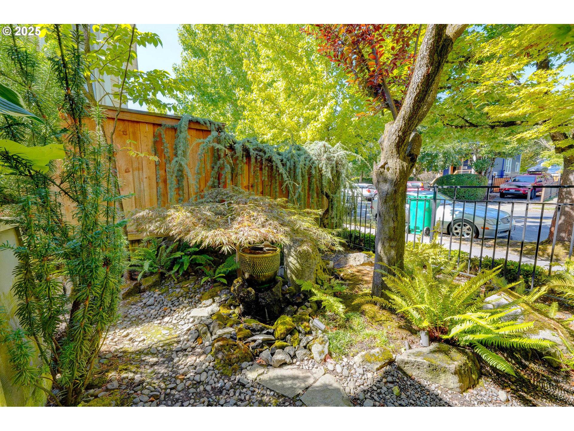 502 Northeast Knott Street Portland, OR 97212 - Photo 5 of 44 a backyard of a house with large trees