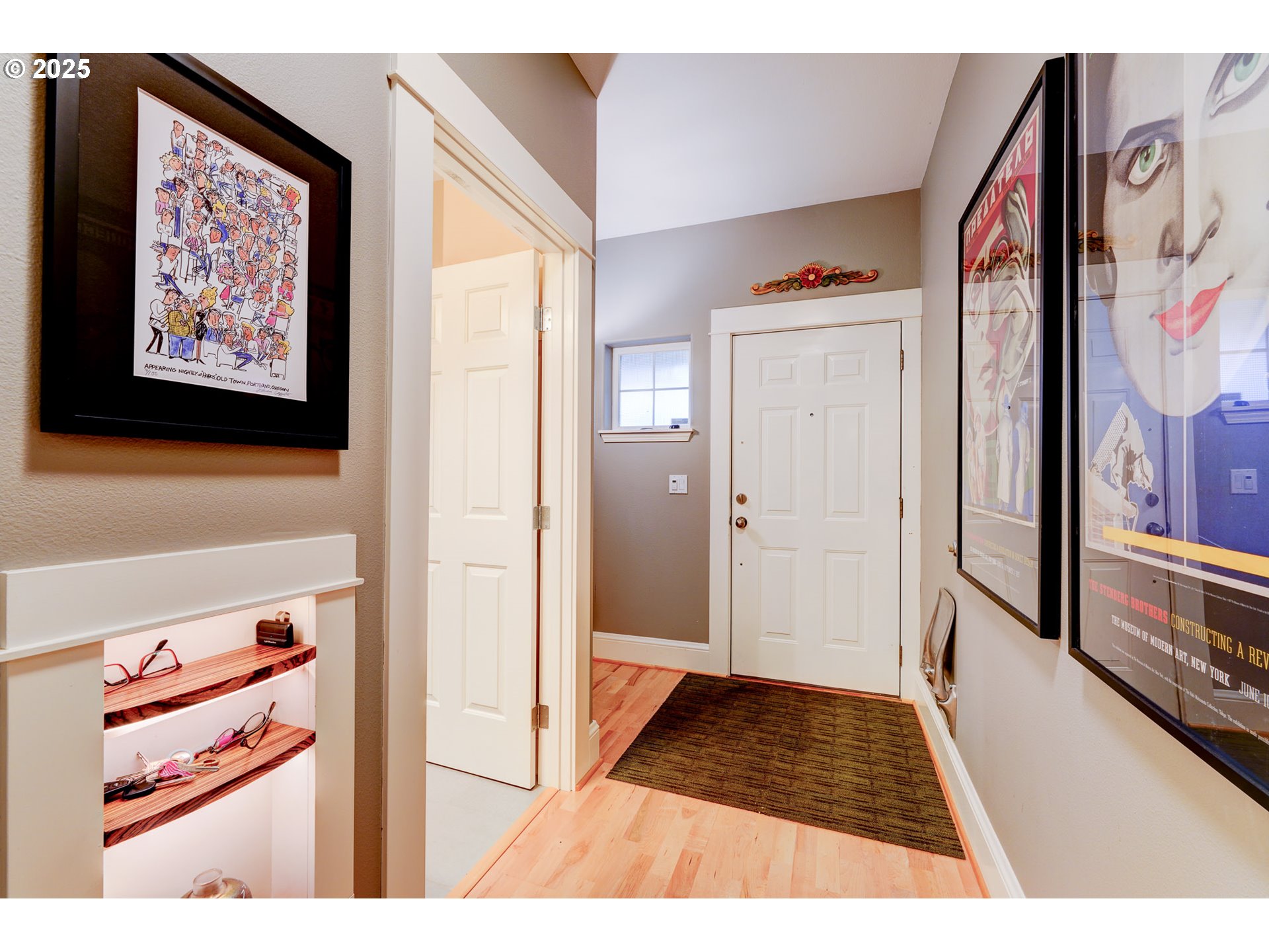 502 Northeast Knott Street Portland, OR 97212 - Photo 6 of 44 a view of a hallway with wooden floor and furniture
