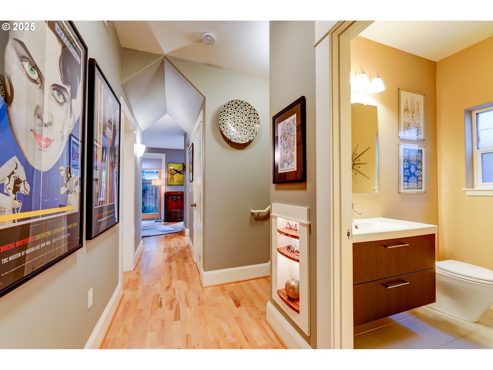 502 Northeast Knott Street Portland, OR 97212 - Photo 7 of 44 a view of a hallway to rooms and wooden floor