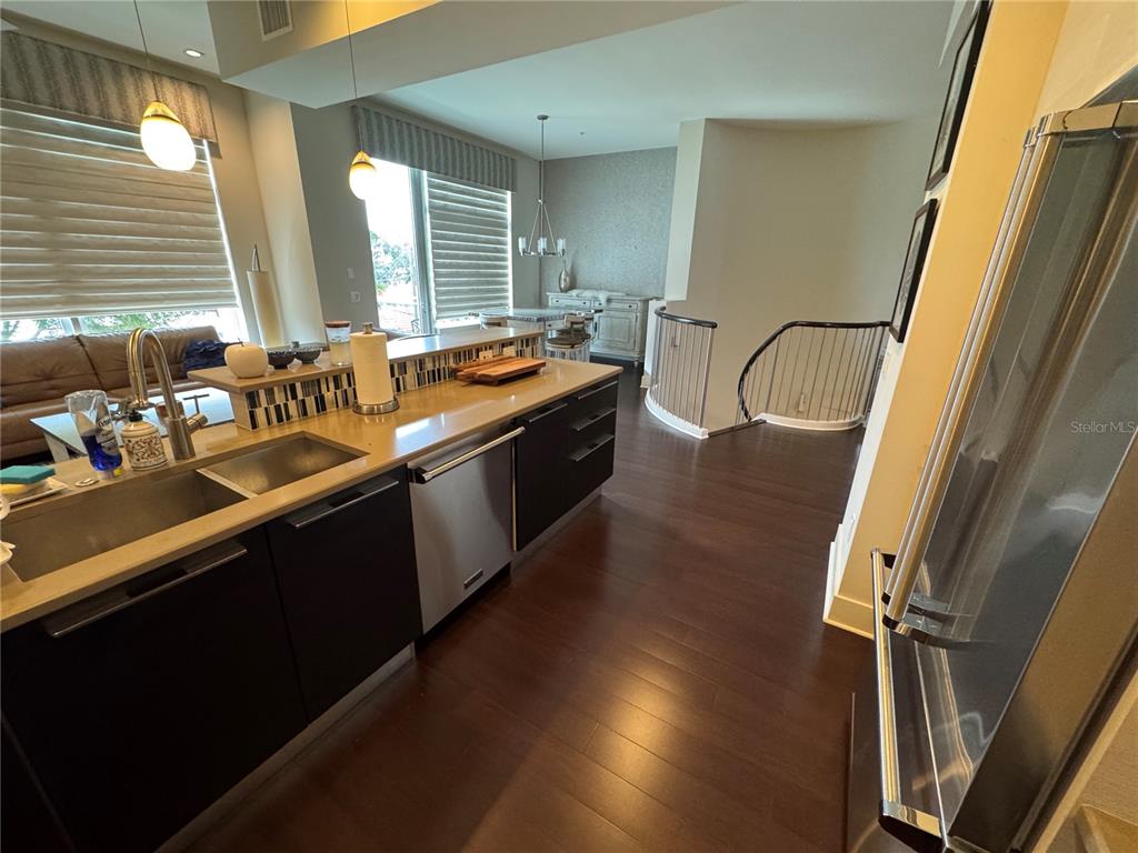 239 Cosmopolitan Court Sarasota, FL 34236 - Photo 11 of 29 a kitchen with counter top space sink and window