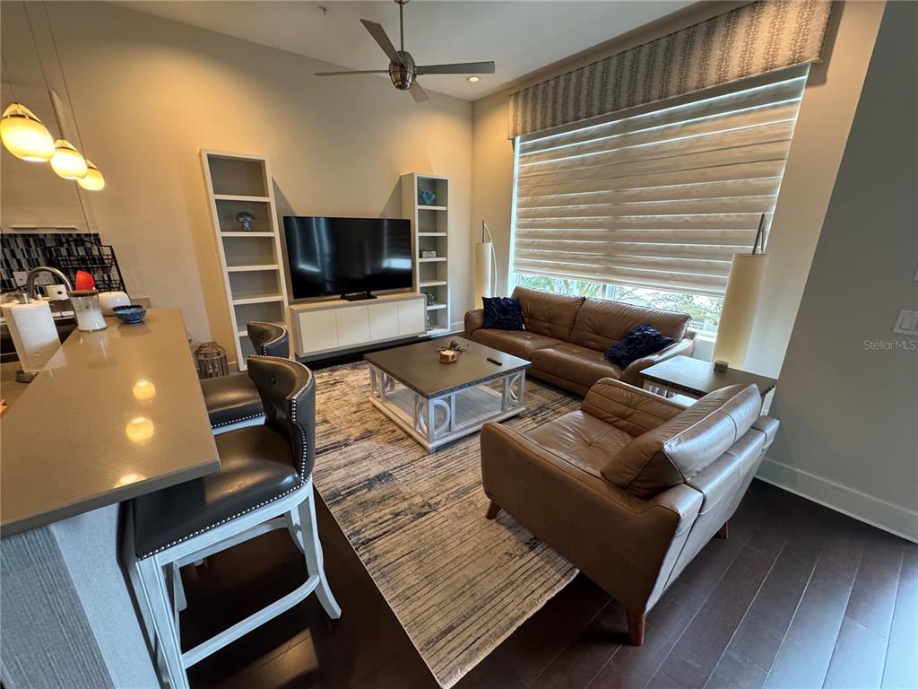 239 Cosmopolitan Court Sarasota, FL 34236 - Photo 12 of 29 a living room with furniture and a flat screen tv