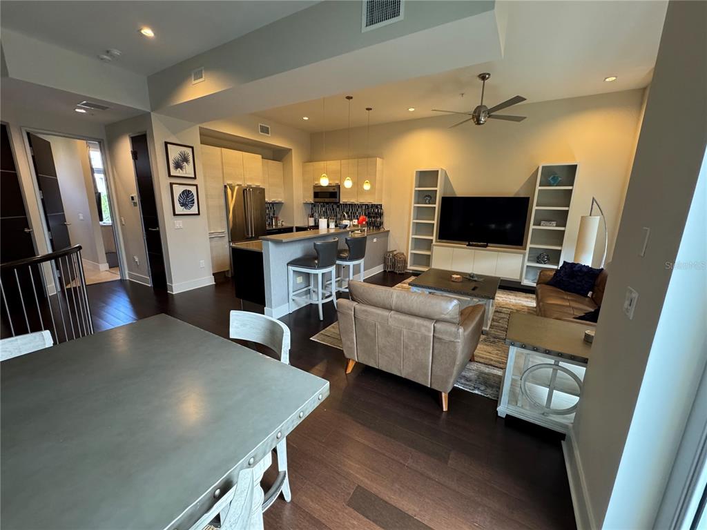 239 Cosmopolitan Court Sarasota, FL 34236 - Photo 13 of 29 a living room with furniture and a flat screen tv