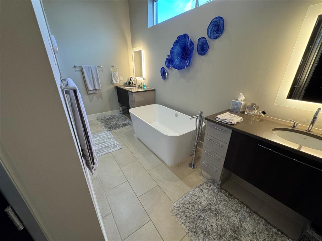 239 Cosmopolitan Court Sarasota, FL 34236 - Photo 18 of 29 a bathroom with a sink and a mirror