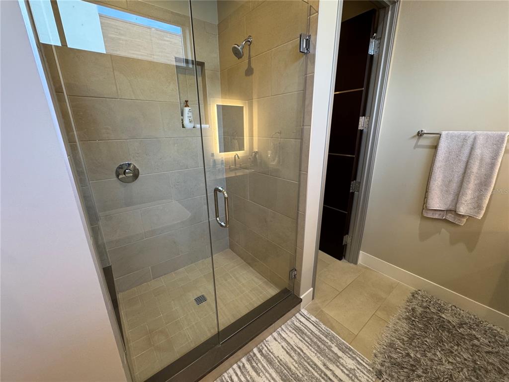 239 Cosmopolitan Court Sarasota, FL 34236 - Photo 20 of 29 a bathroom with a shower