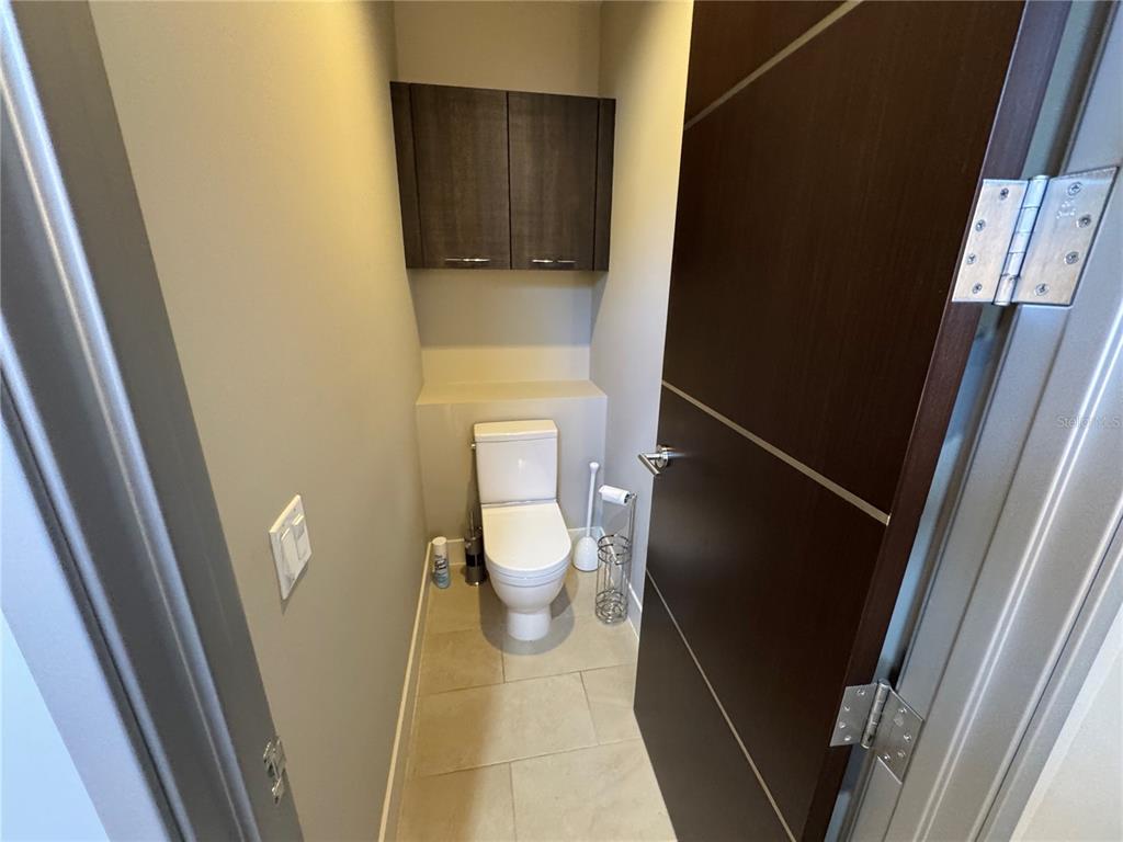 239 Cosmopolitan Court Sarasota, FL 34236 - Photo 21 of 29 a bathroom with a toilet and a shower