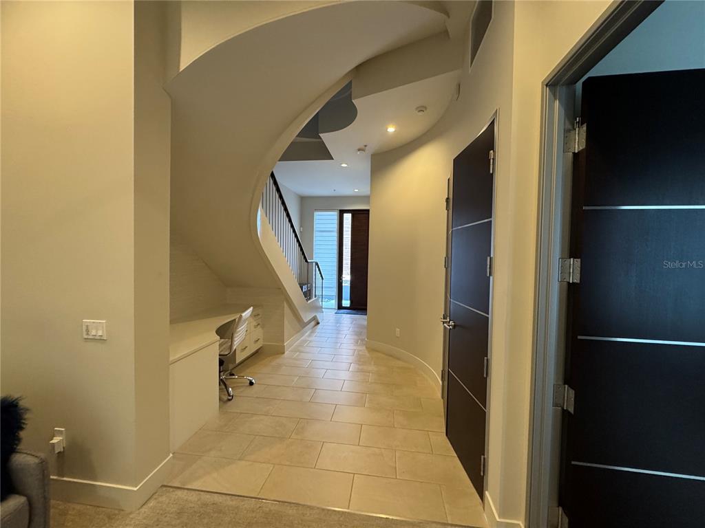 239 Cosmopolitan Court Sarasota, FL 34236 - Photo 4 of 29 a view of a hallway with workspace