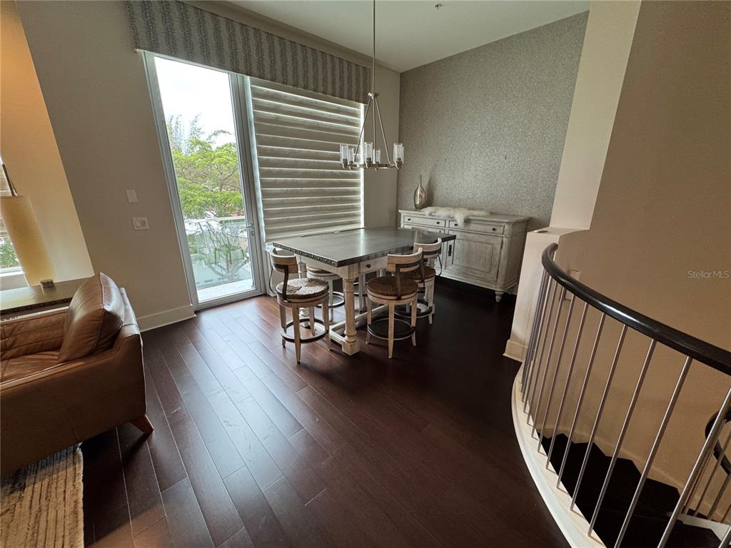 239 Cosmopolitan Court Sarasota, FL 34236 - Photo 7 of 29 a living room with furniture and a wooden floor