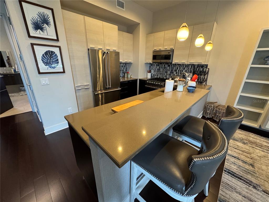 239 Cosmopolitan Court Sarasota, FL 34236 - Photo 9 of 29 a view of a dining room with furniture and wooden floor