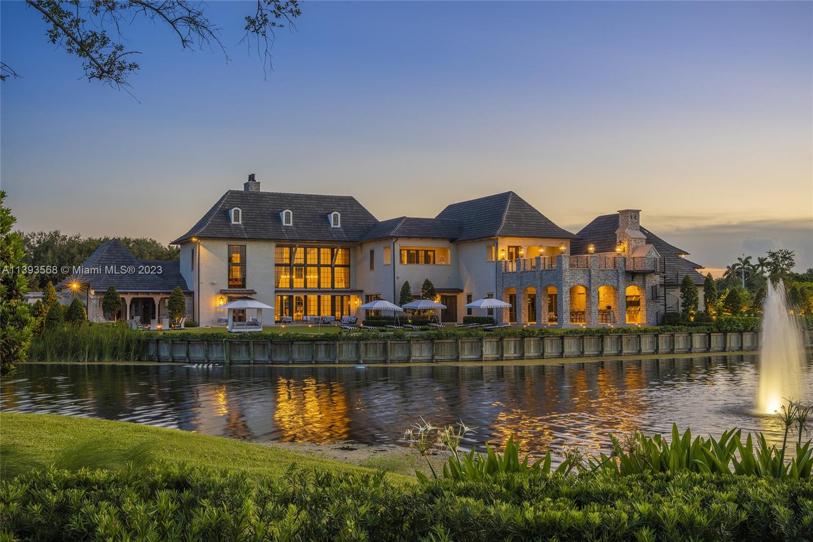 13000 Lewin Lane Southwest Ranches, FL 33330 - Photo 2 of 47 a front view of a house with a lake view
