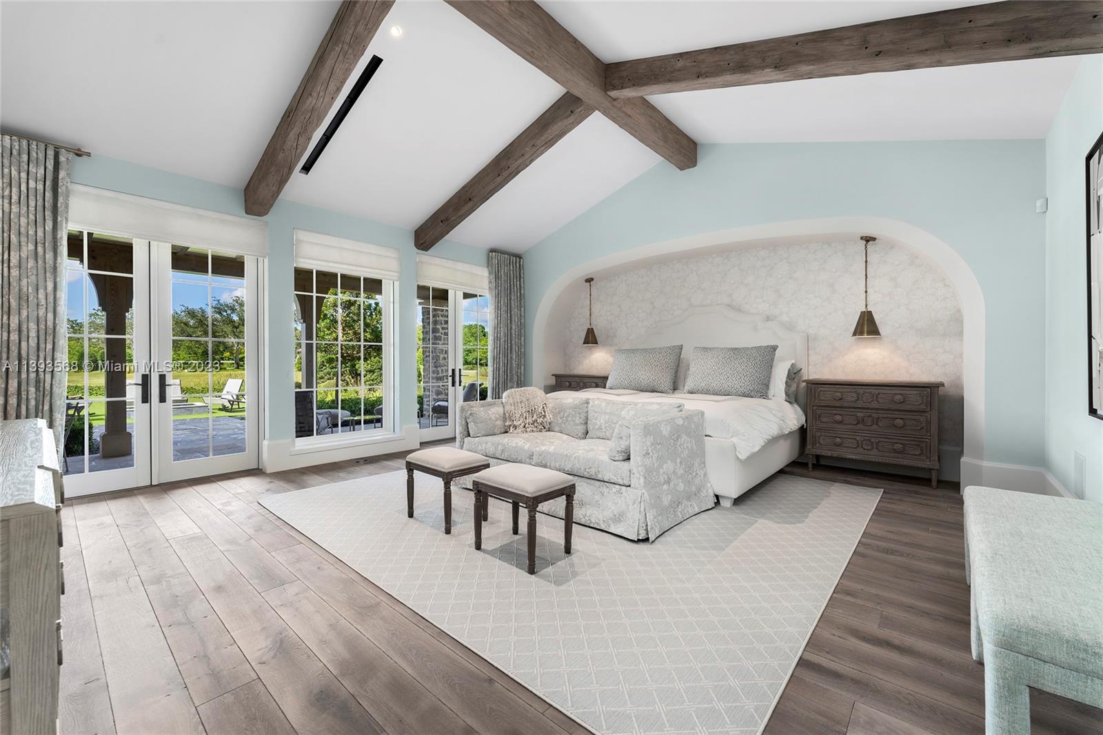 13000 Lewin Lane Southwest Ranches, FL 33330 - Photo 24 of 47 a spacious bedroom with a bed and a large window