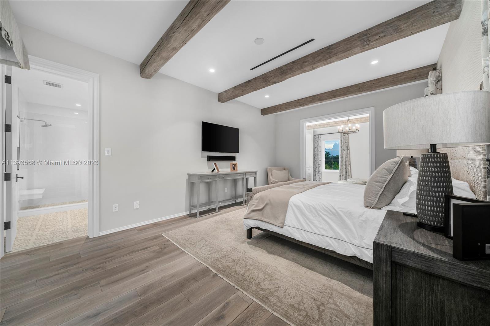 13000 Lewin Lane Southwest Ranches, FL 33330 - Photo 37 of 47 a spacious bedroom with a bed and a flat screen television