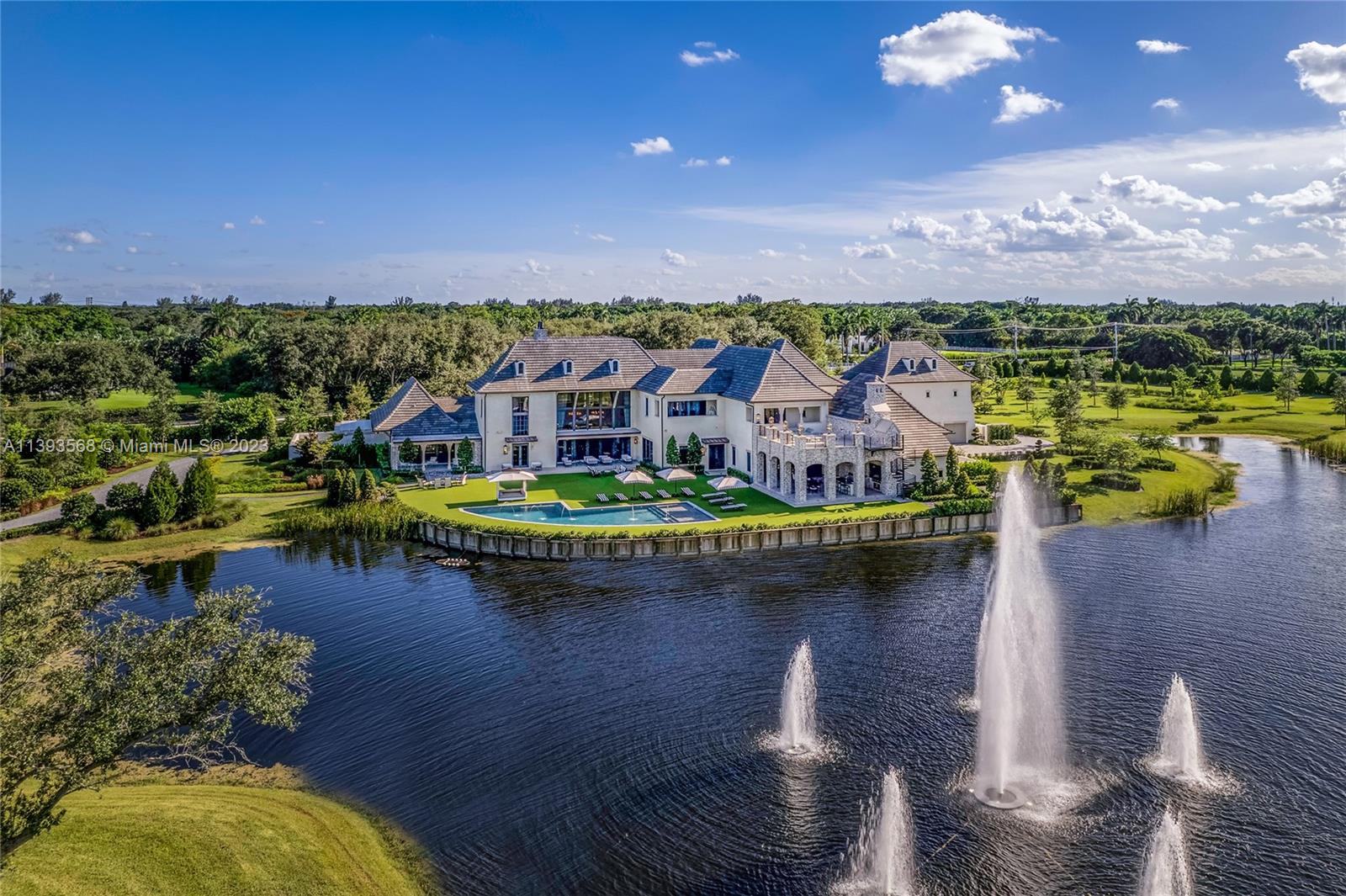 13000 Lewin Lane Southwest Ranches, FL 33330 - Photo 41 of 47 a view of a lake with a house in the background