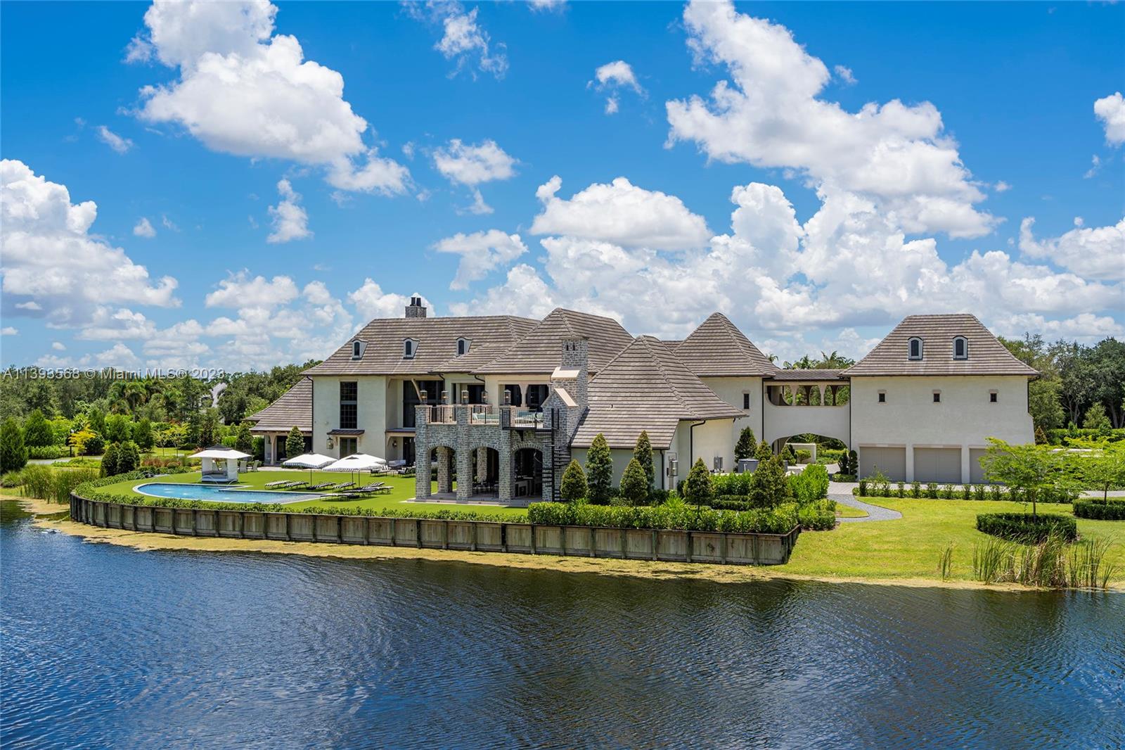 13000 Lewin Lane Southwest Ranches, FL 33330 - Photo 43 of 47 a front view of a house with swimming pool and trees in the background