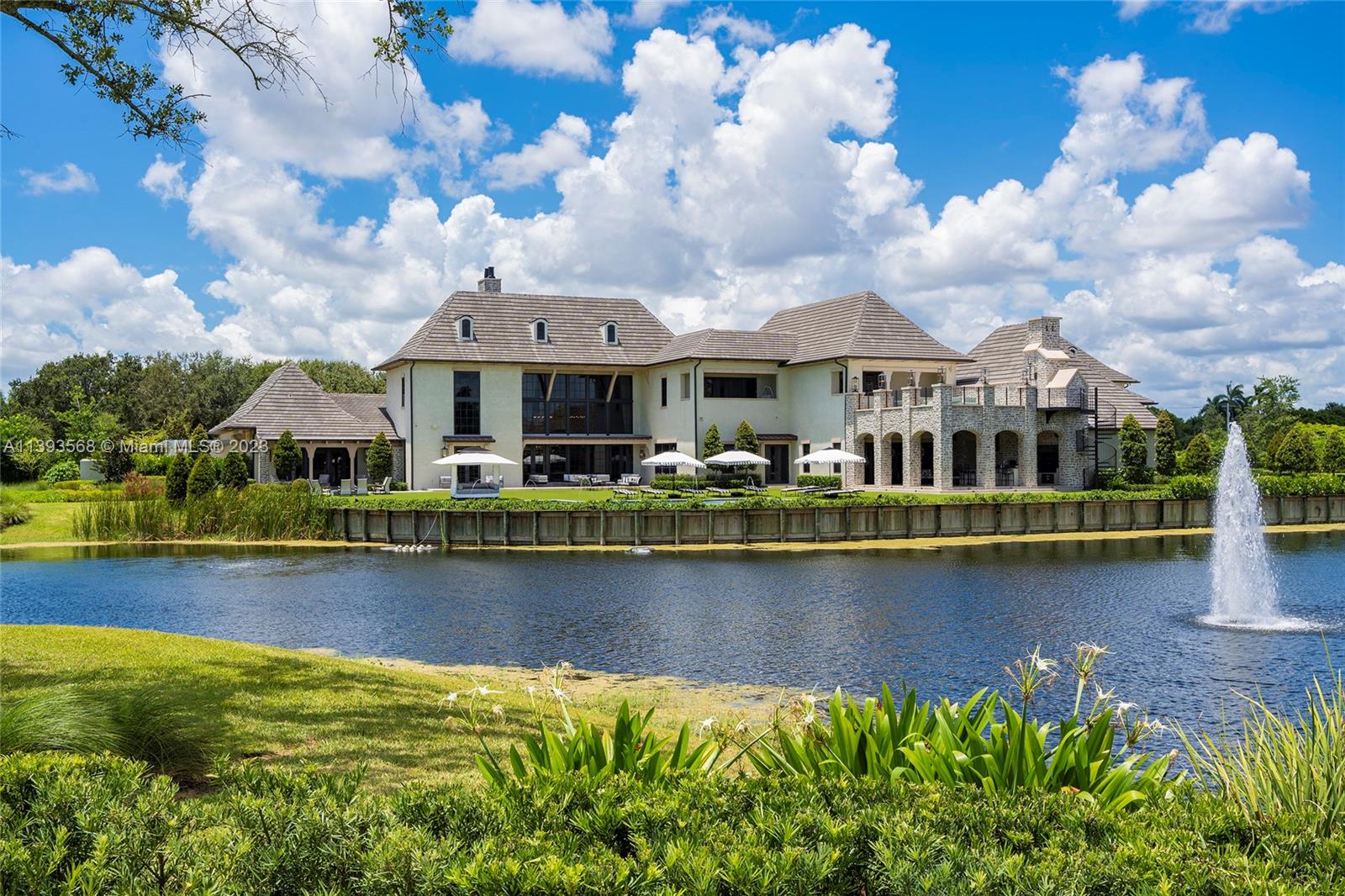 13000 Lewin Lane Southwest Ranches, FL 33330 - Photo 44 of 47 a front view of a house with a garden and lake view