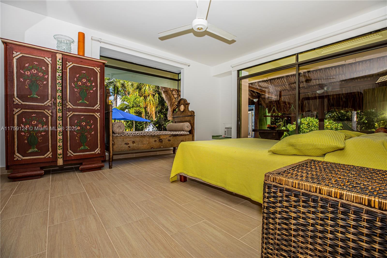 9 Via Girardot Tocaima undefined, CU 00000 - Photo 11 of 23 a bedroom with a bed and glass door