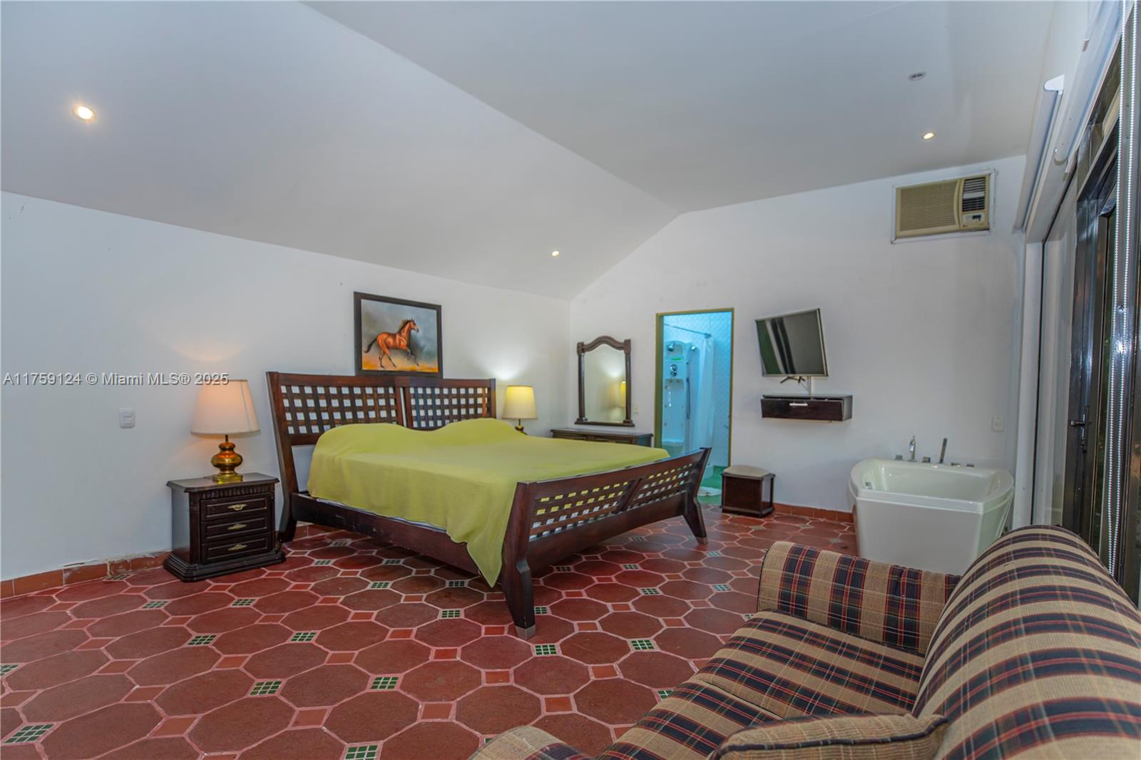 9 Via Girardot Tocaima undefined, CU 00000 - Photo 16 of 23 a bedroom with a bed and wooden floor