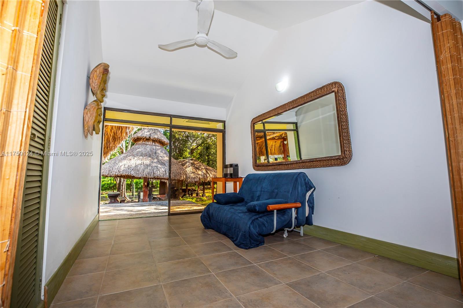 9 Via Girardot Tocaima undefined, CU 00000 - Photo 20 of 23 a living room with furniture and a flat screen tv