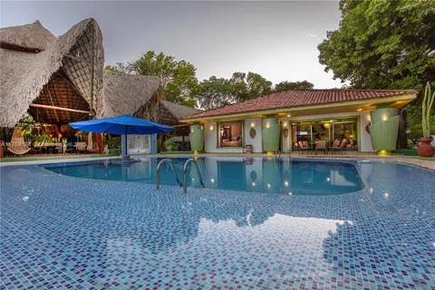an entryway of a house with outdoor seating