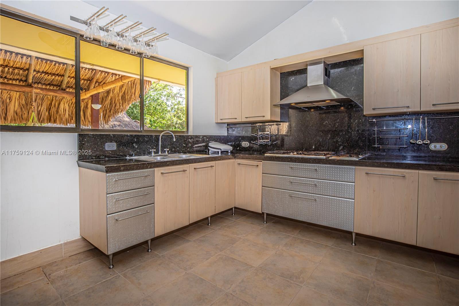 9 Via Girardot Tocaima undefined, CU 00000 - Photo 9 of 23 a kitchen with white cabinets and white appliances
