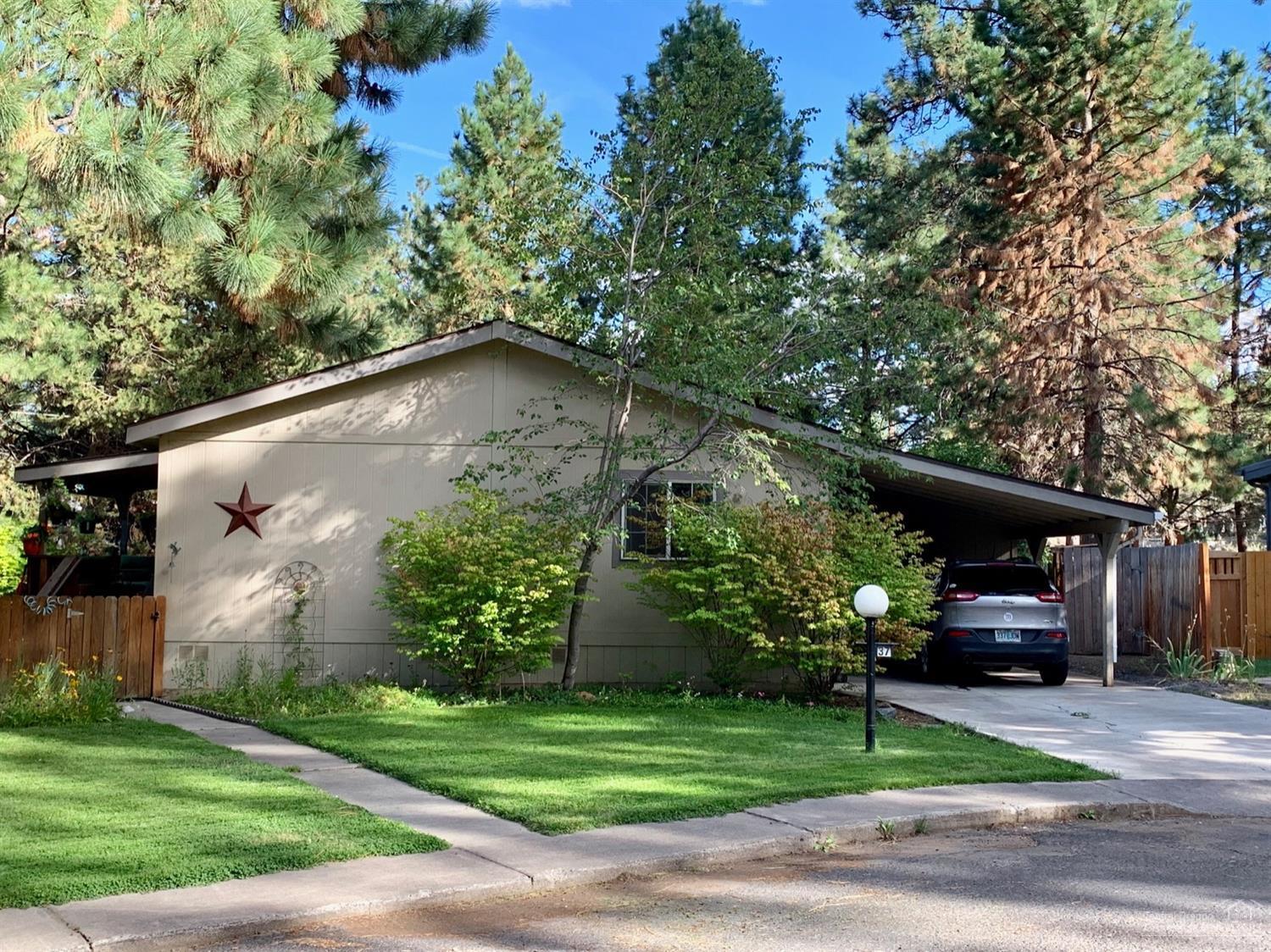 141 Southwest 15th Street, Unit 37 Bend, OR 97702 - Photo 23 of 23 Carport and storage shed