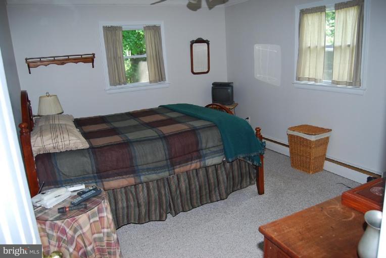 27708 Ridge Road Damascus, MD 20872 - Photo 6 of 8 a bedroom with bed and a window