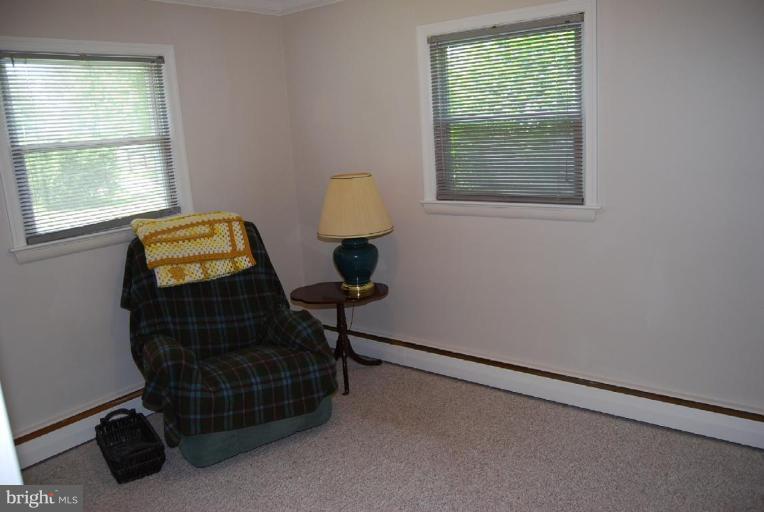 27708 Ridge Road Damascus, MD 20872 - Photo 7 of 8 a room with a window and a dresser