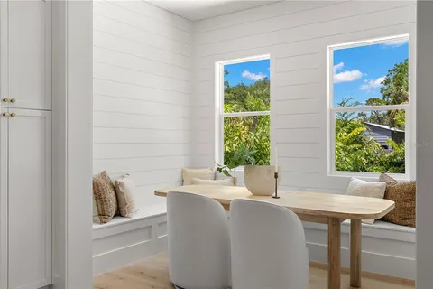a kitchen with a table chairs and a stove