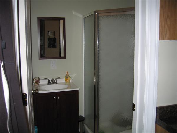 32 Rimmon Avenue Chicopee, MA 01013 - Photo 7 of 16 a en suite bathroom with a sink and mirror