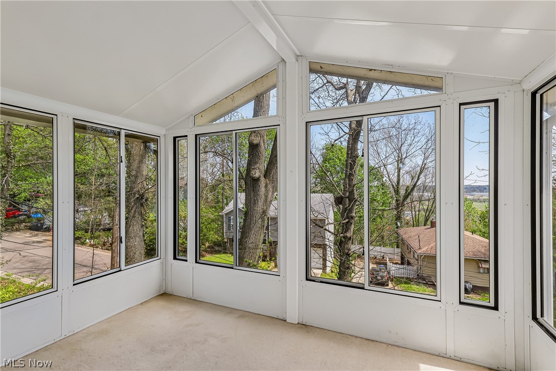 2060 6th Street Southwest Akron, OH 44314 - Photo 10 of 46 Sun room with high ceiling and plenty of windows