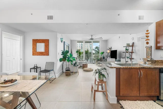 a kitchen with a table and chairs in it