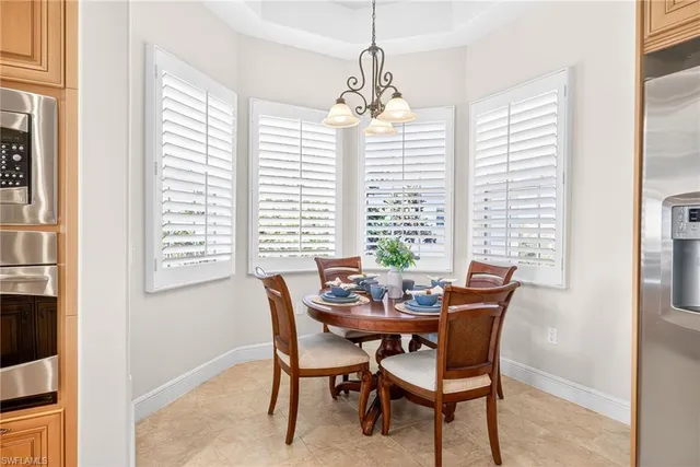 a dining room with furniture and window