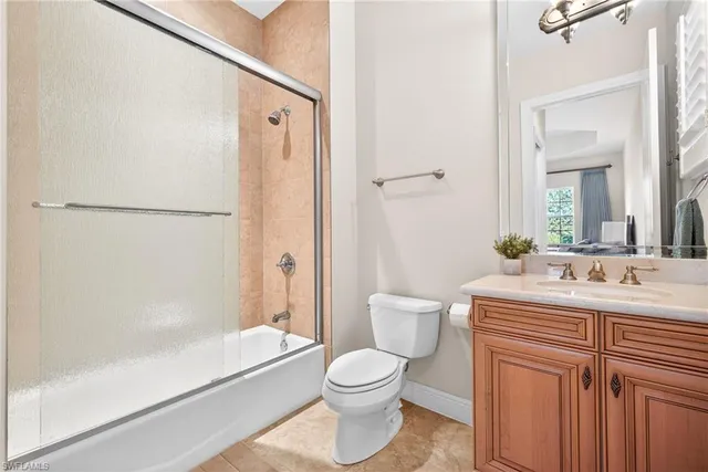 a bathroom with a toilet a sink and a bathtub