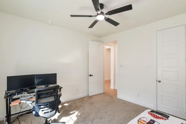 a bedroom with furniture and a window